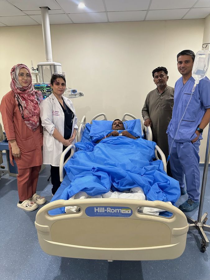 Dr. Fazal Zaidi with patient at hospital